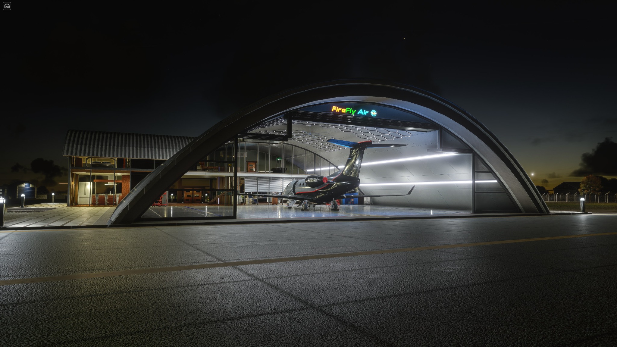 FSReborn Phenom 300E at the FireFly Air FBO hangar at night in MSFS 2024